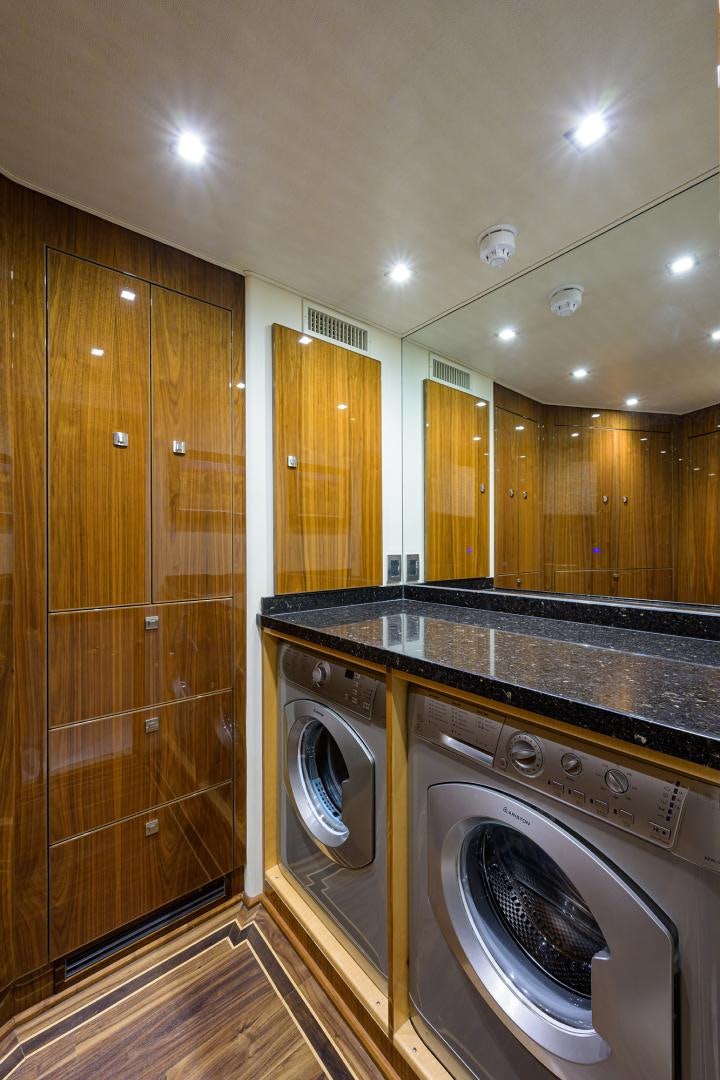 a washer and dryer in a bathroom aboard SET IN MY WAVES Yacht for Sale