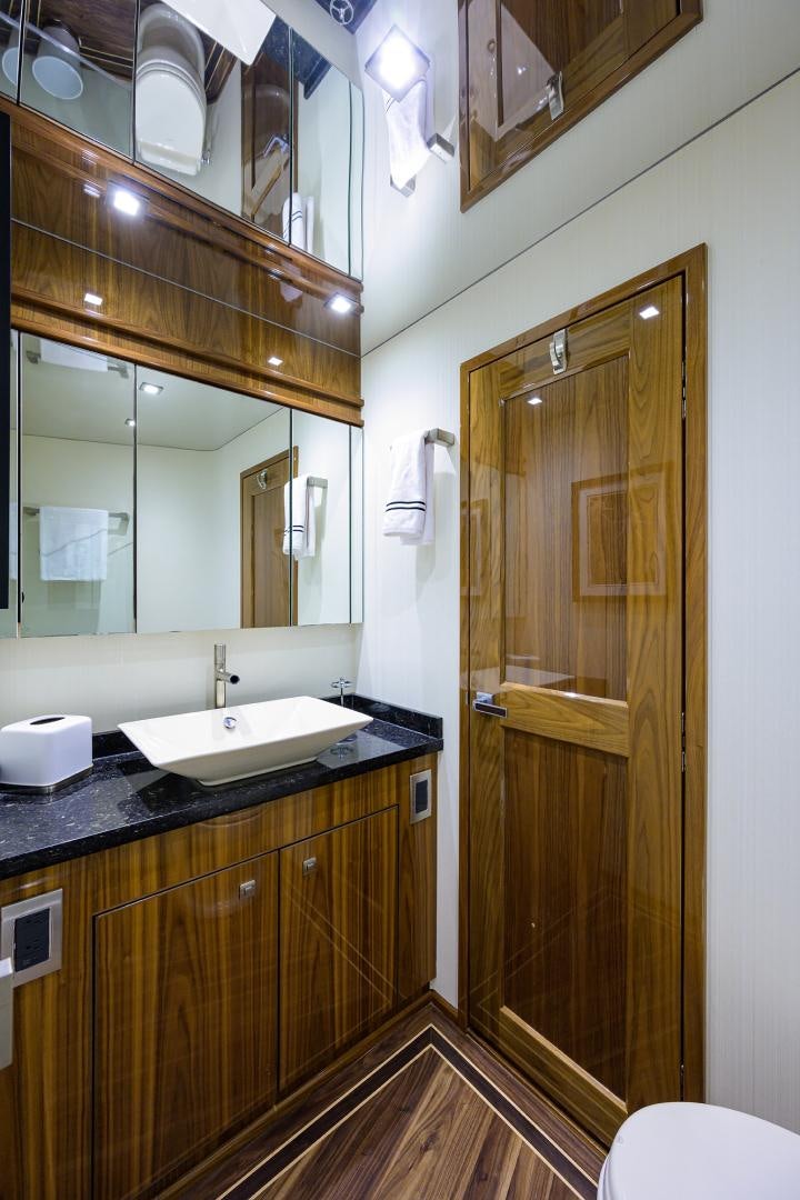 a bathroom with a glass shower door aboard SET IN MY WAVES Yacht for Sale