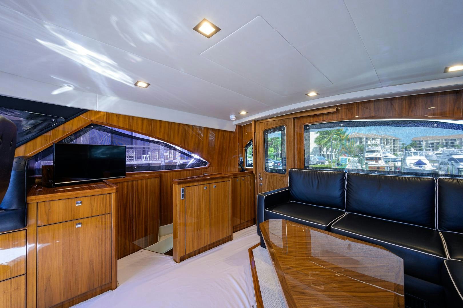 a room with a couch and a tv aboard SET IN MY WAVES Yacht for Sale