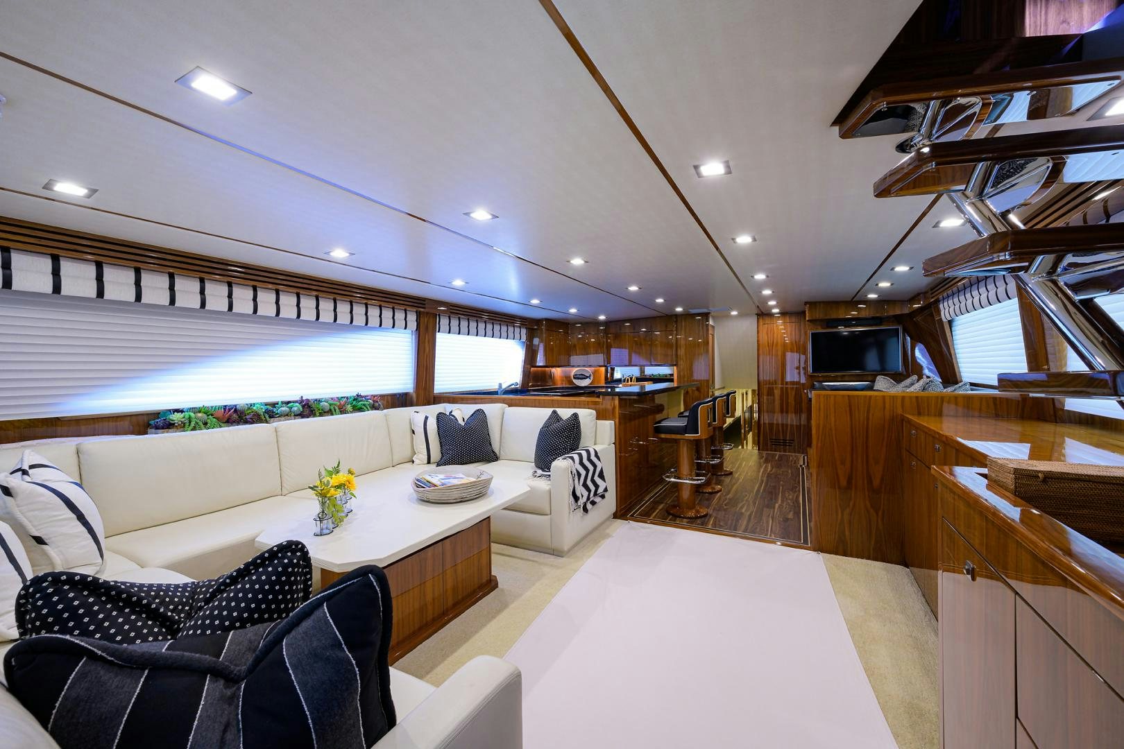 a living room with a large window aboard SET IN MY WAVES Yacht for Sale