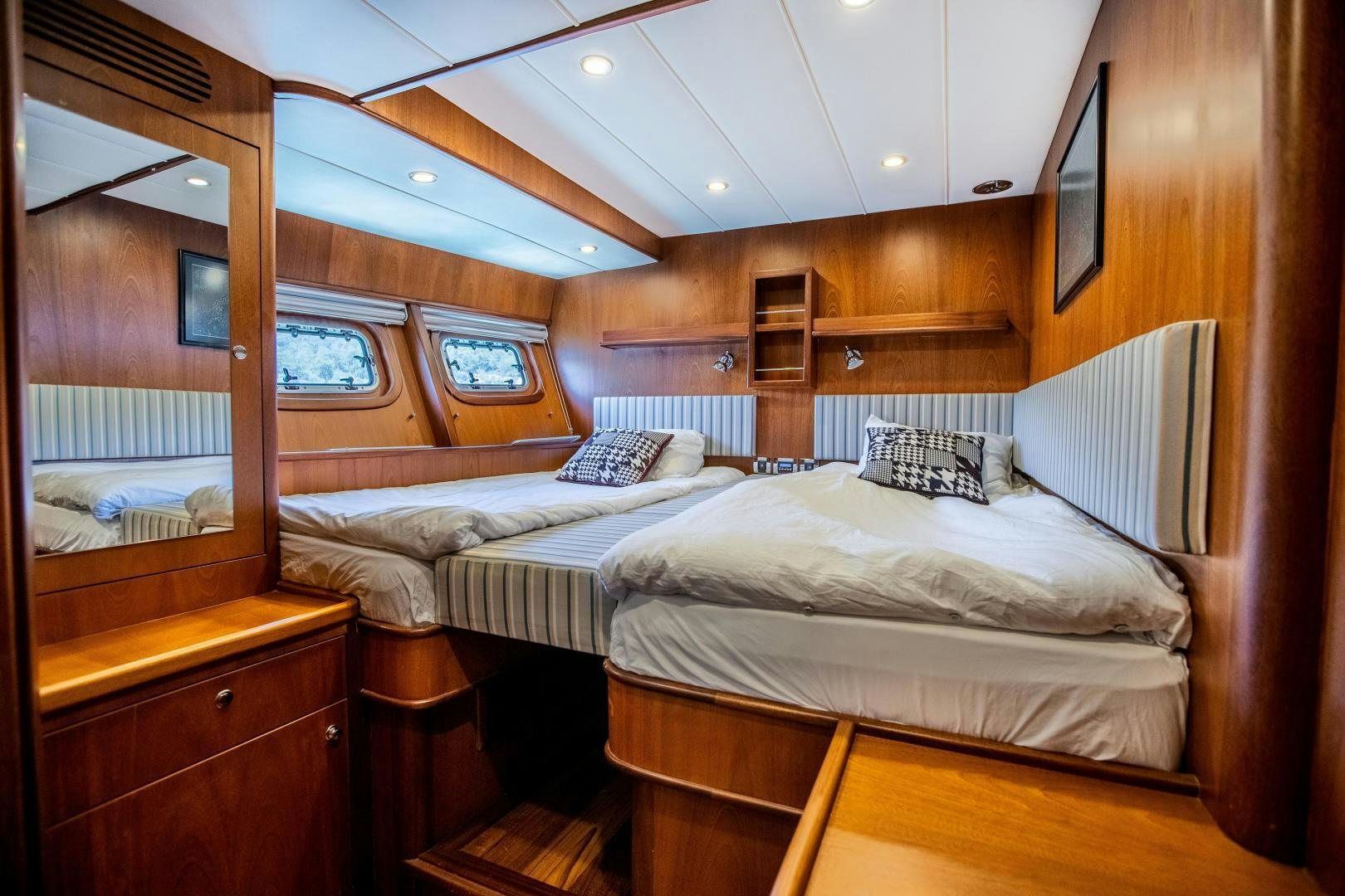 a room with a bed and a mirror aboard DILNISIN Yacht for Sale
