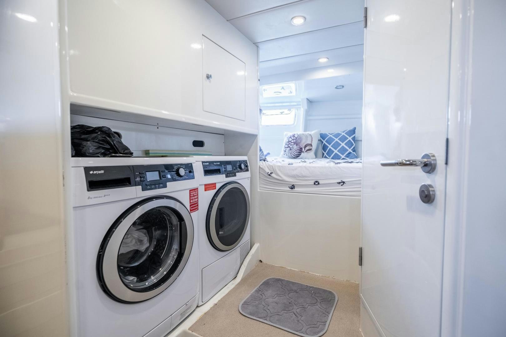 a laundry room with a washing machine aboard DILNISIN Yacht for Sale