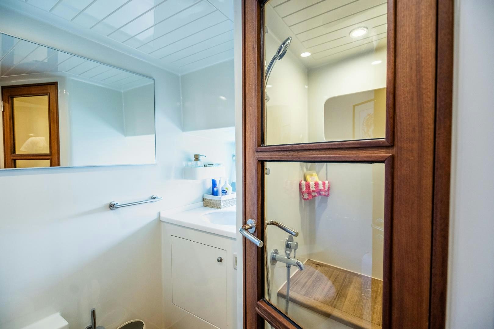 a bathroom with a mirror and a sink aboard DILNISIN Yacht for Sale