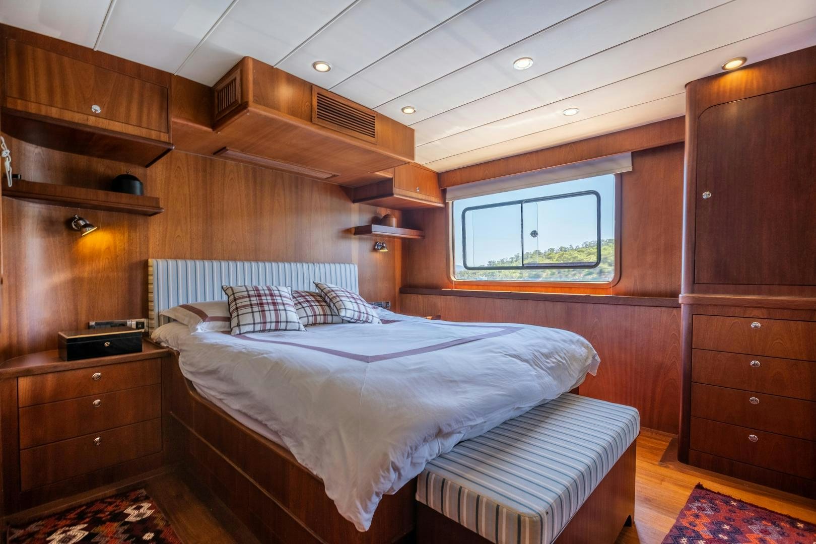 a cabin with a bed aboard DILNISIN Yacht for Sale