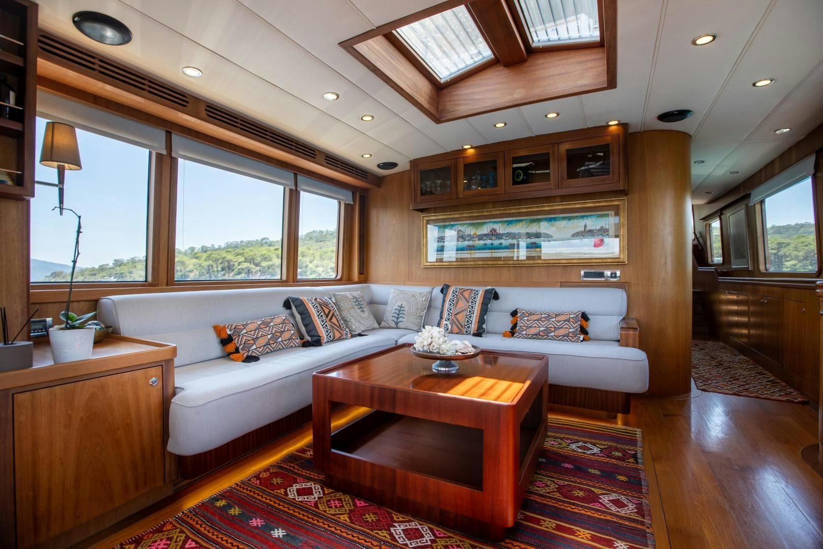 a living room with a couch and a coffee table aboard DILNISIN Yacht for Sale