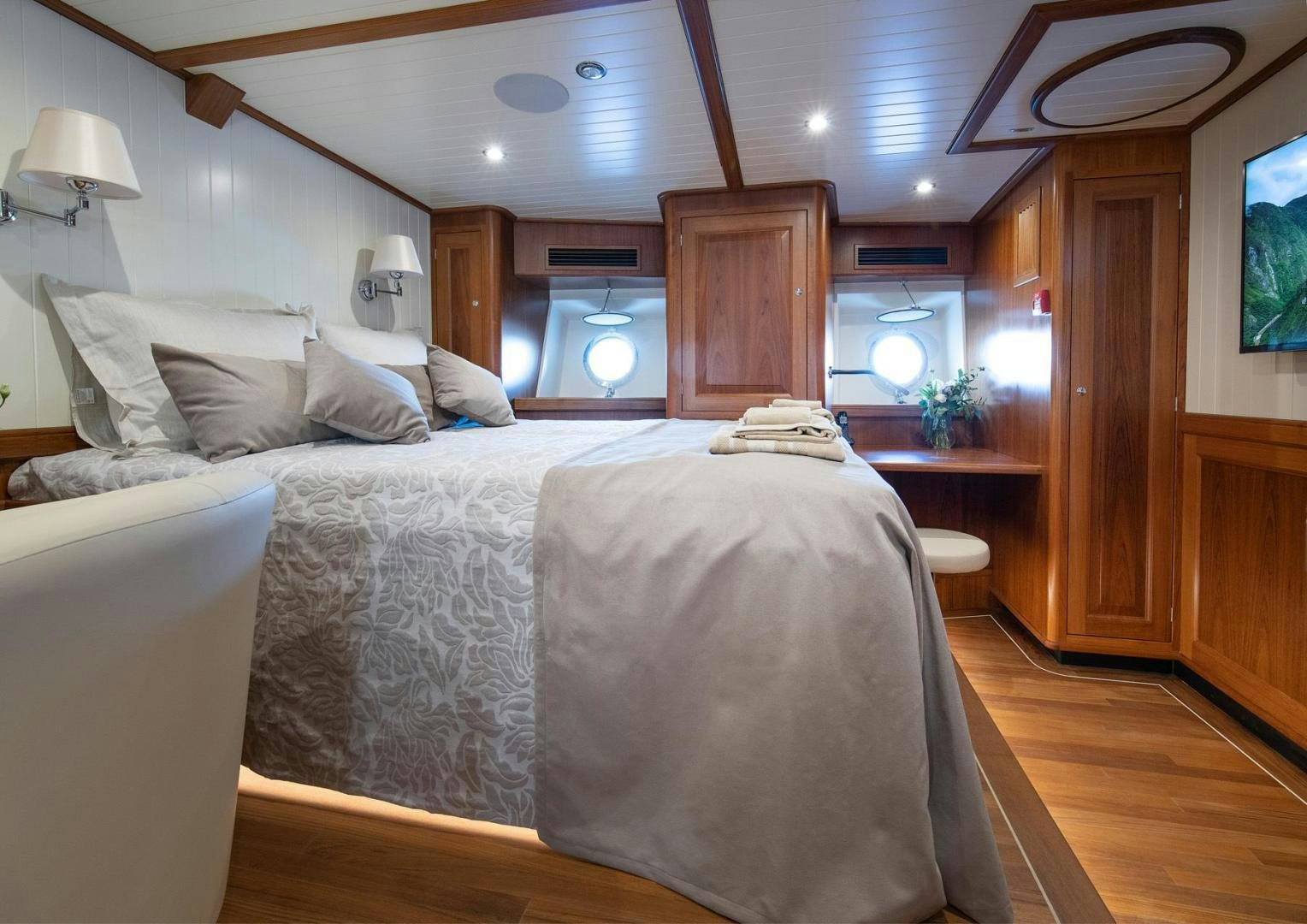 a bedroom with a large bed aboard MELODY Yacht for Sale