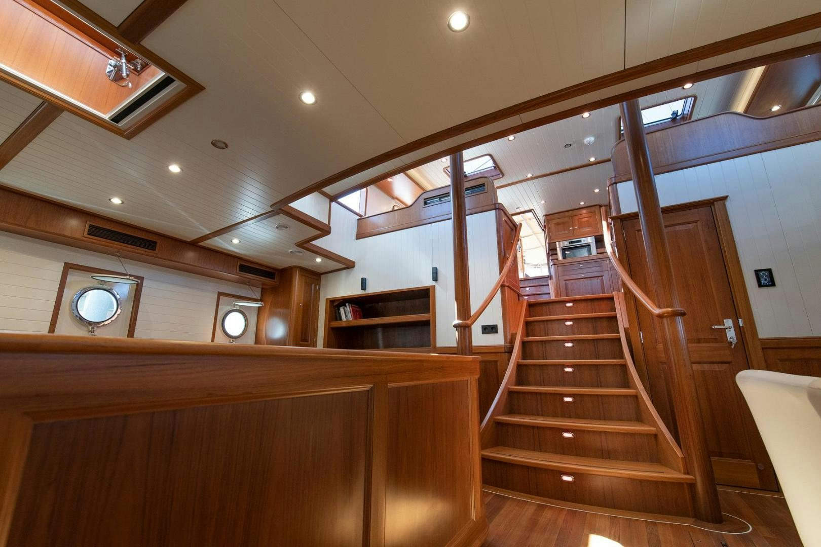 a wooden staircase in a house aboard MELODY Yacht for Sale