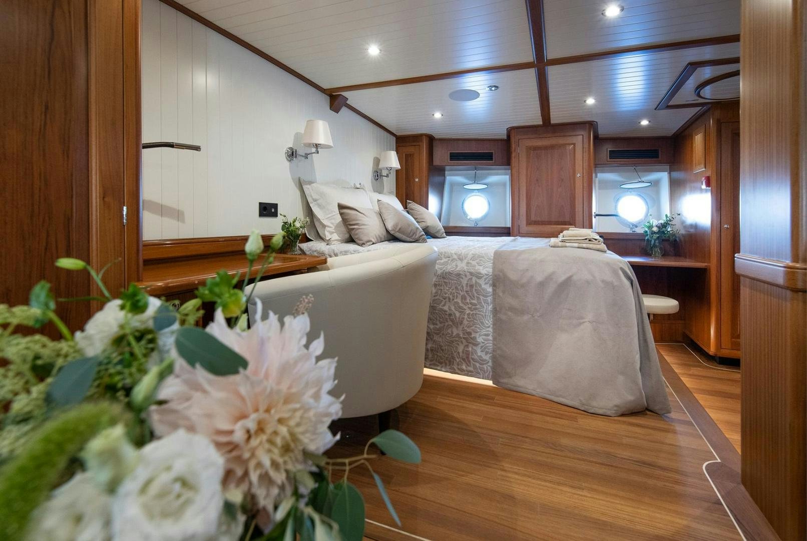 a room with a bed and a table aboard MELODY Yacht for Sale