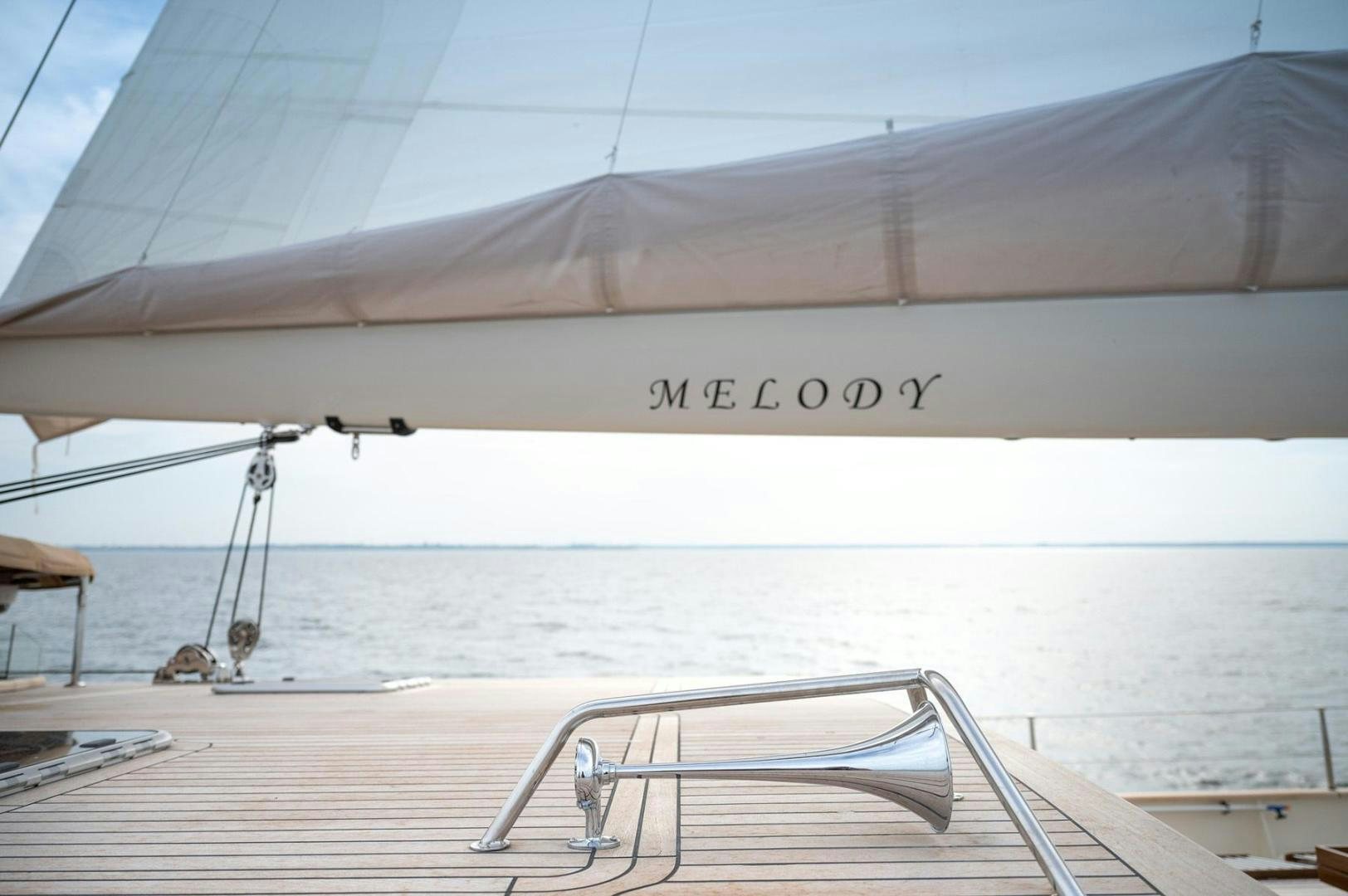 a white tent on a beach aboard MELODY Yacht for Sale