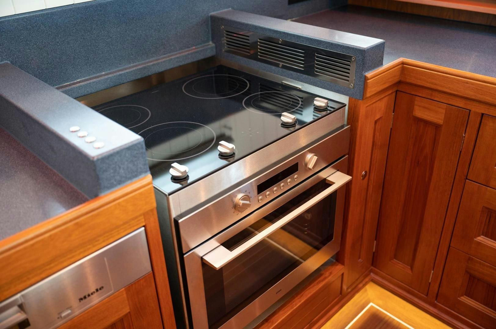 a stove top with a vent aboard MELODY Yacht for Sale