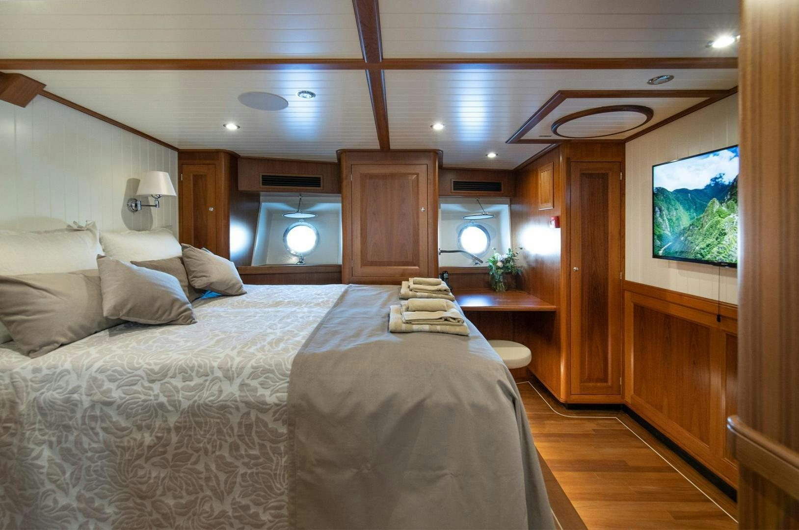 a bedroom with a large bed aboard MELODY Yacht for Sale