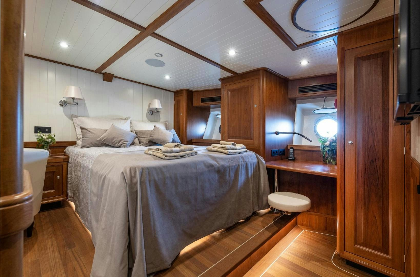 a bed in a room aboard MELODY Yacht for Sale