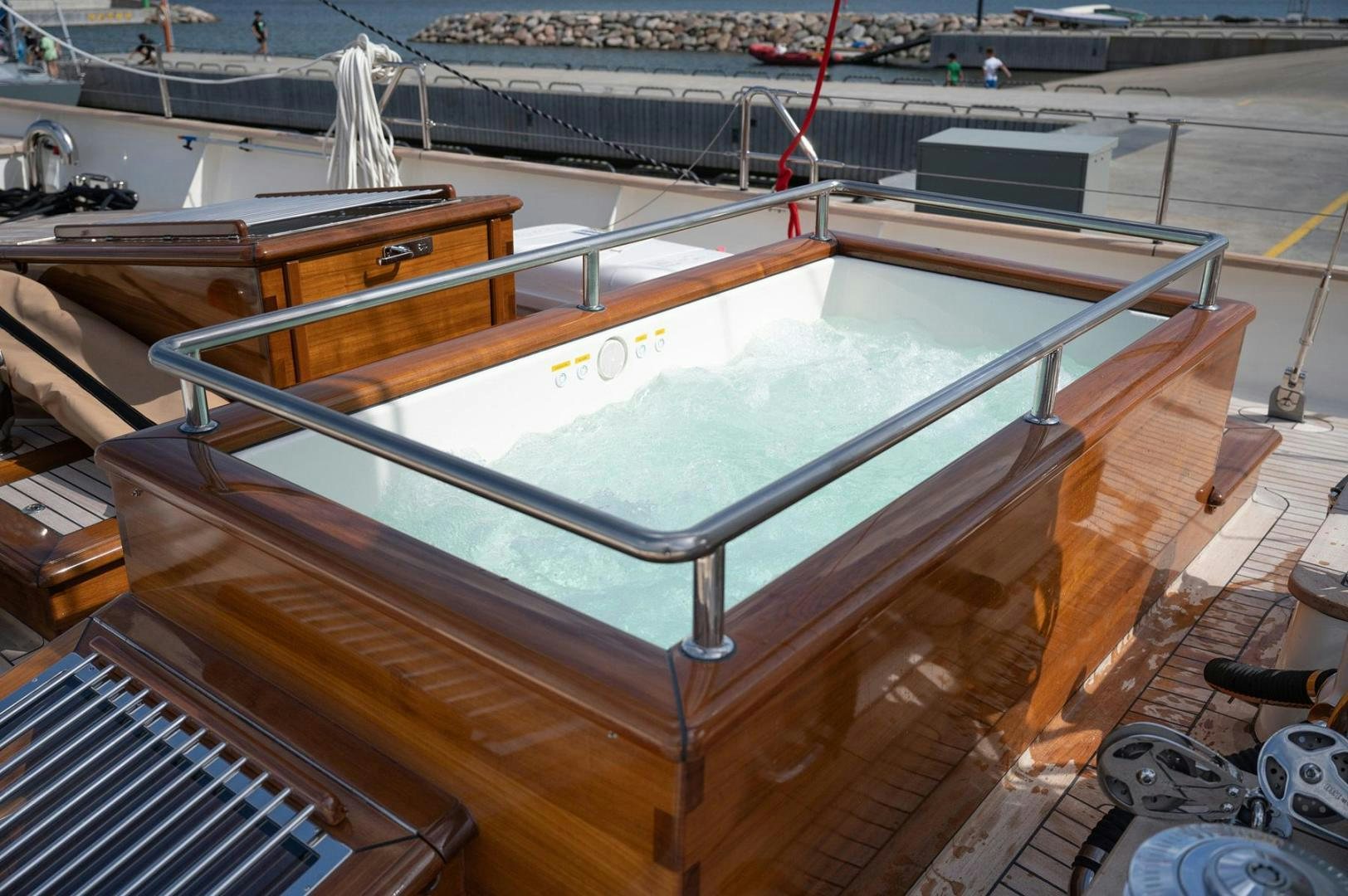 a large pool with a deck aboard MELODY Yacht for Sale
