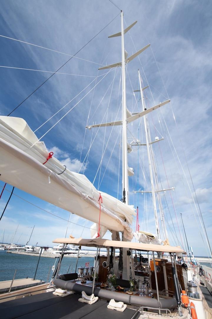 a large white boat docked aboard MELODY Yacht for Sale