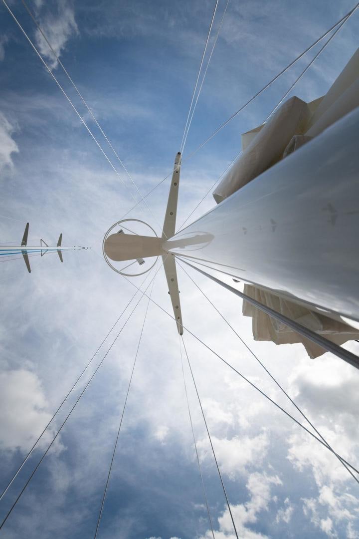 a white windmill against a blue sky aboard MELODY Yacht for Sale