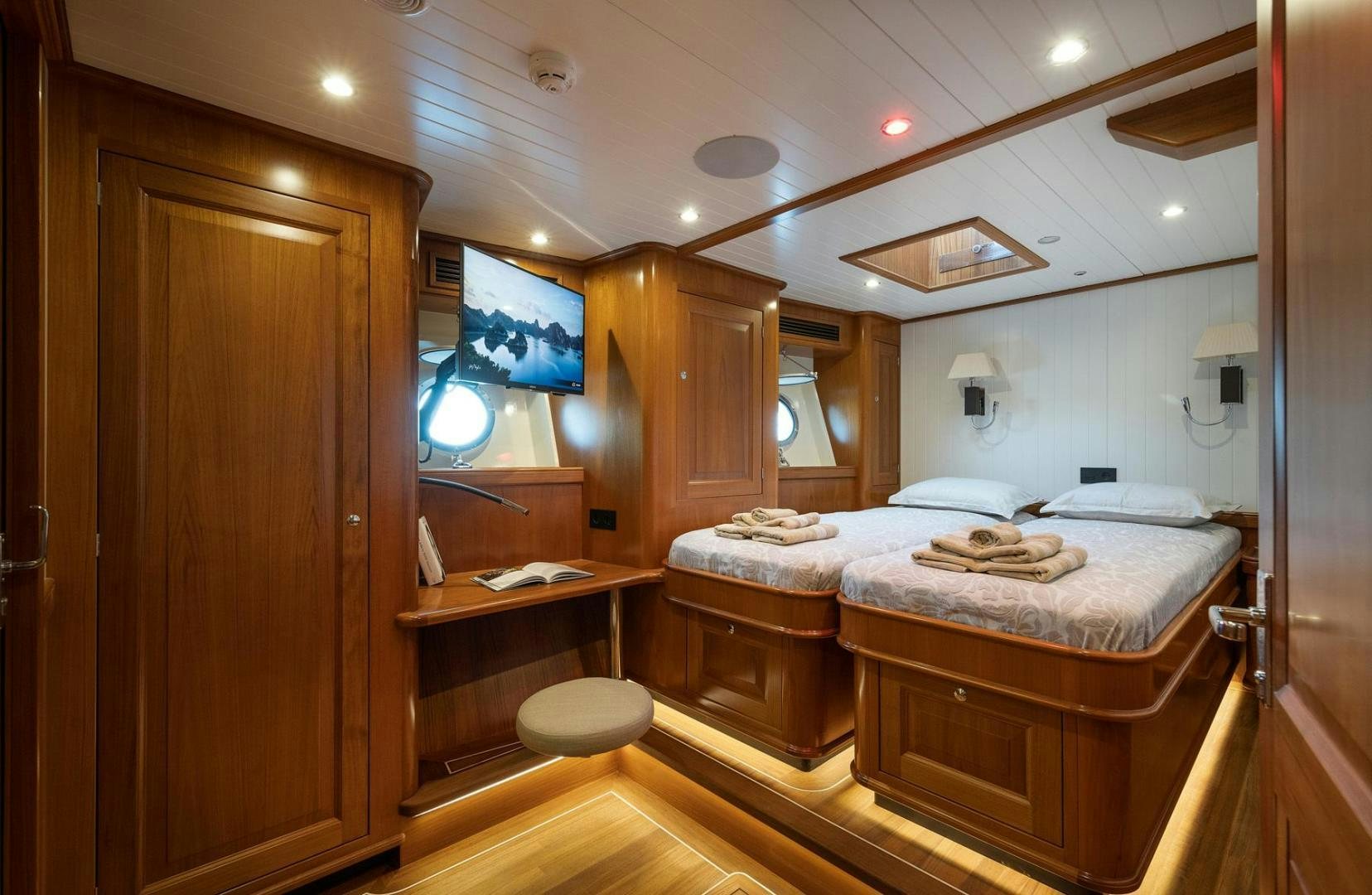 a bathroom with a bed and a mirror aboard MELODY Yacht for Sale