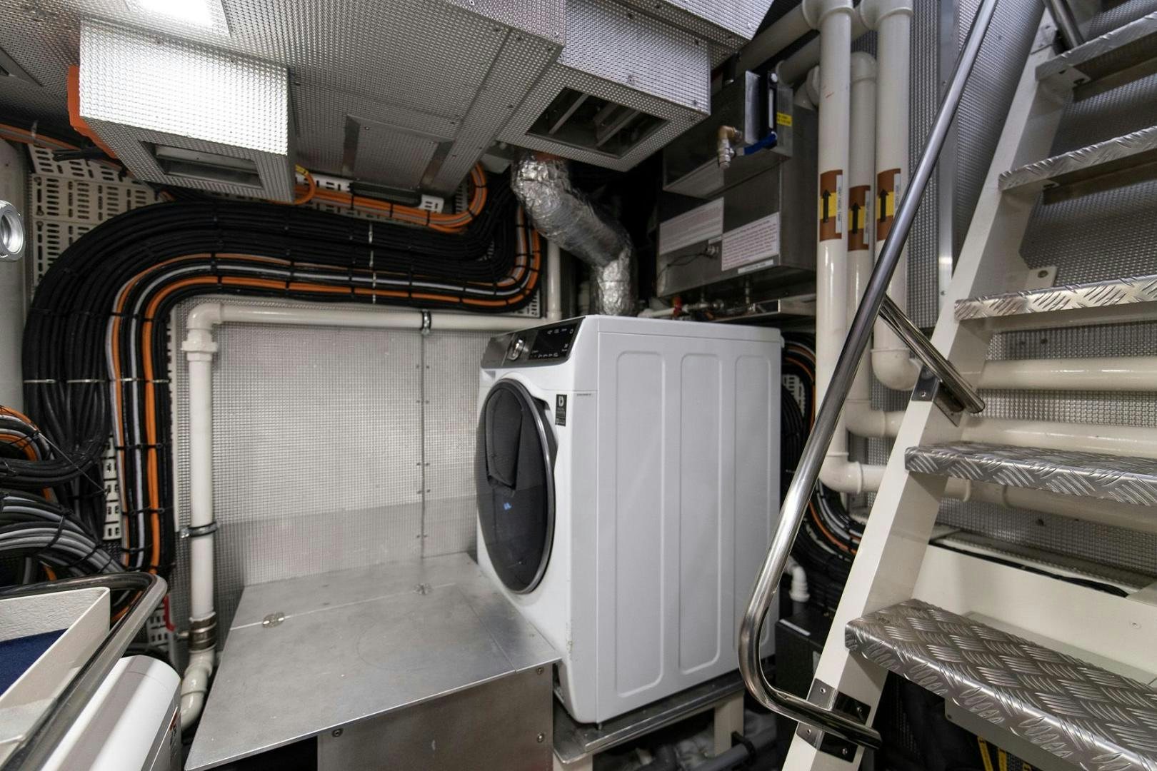 a large machine in a room aboard MELODY Yacht for Sale