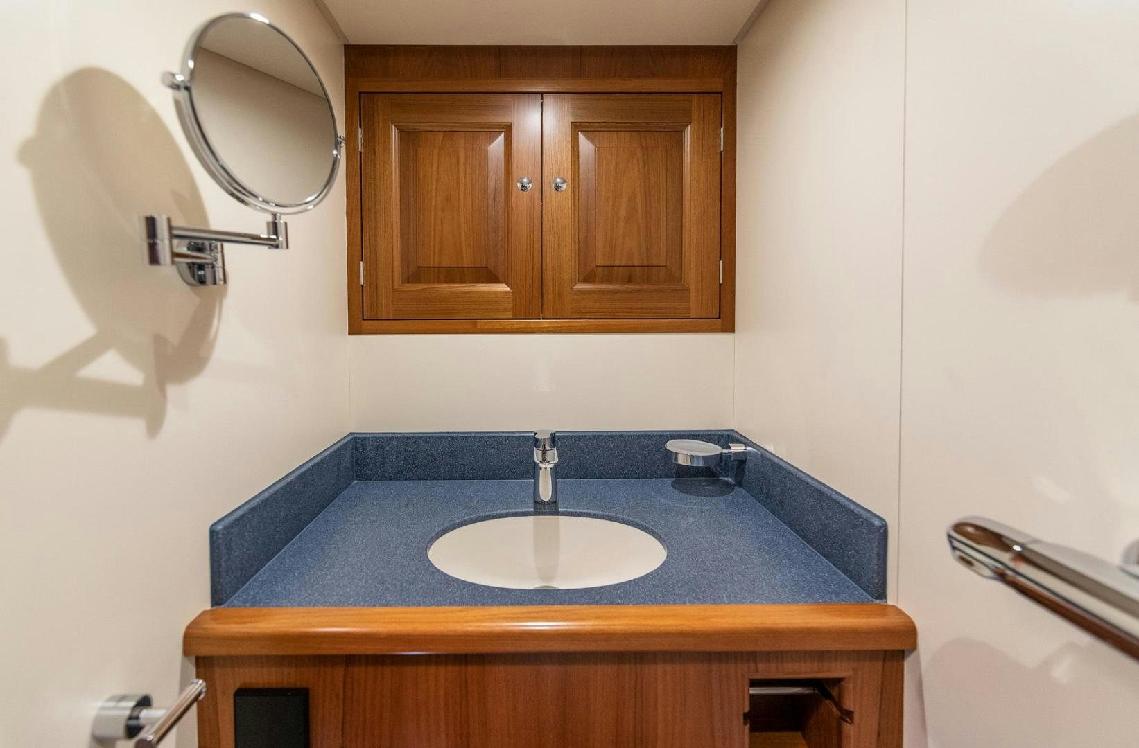 a bathroom with a sink and mirror aboard MELODY Yacht for Sale