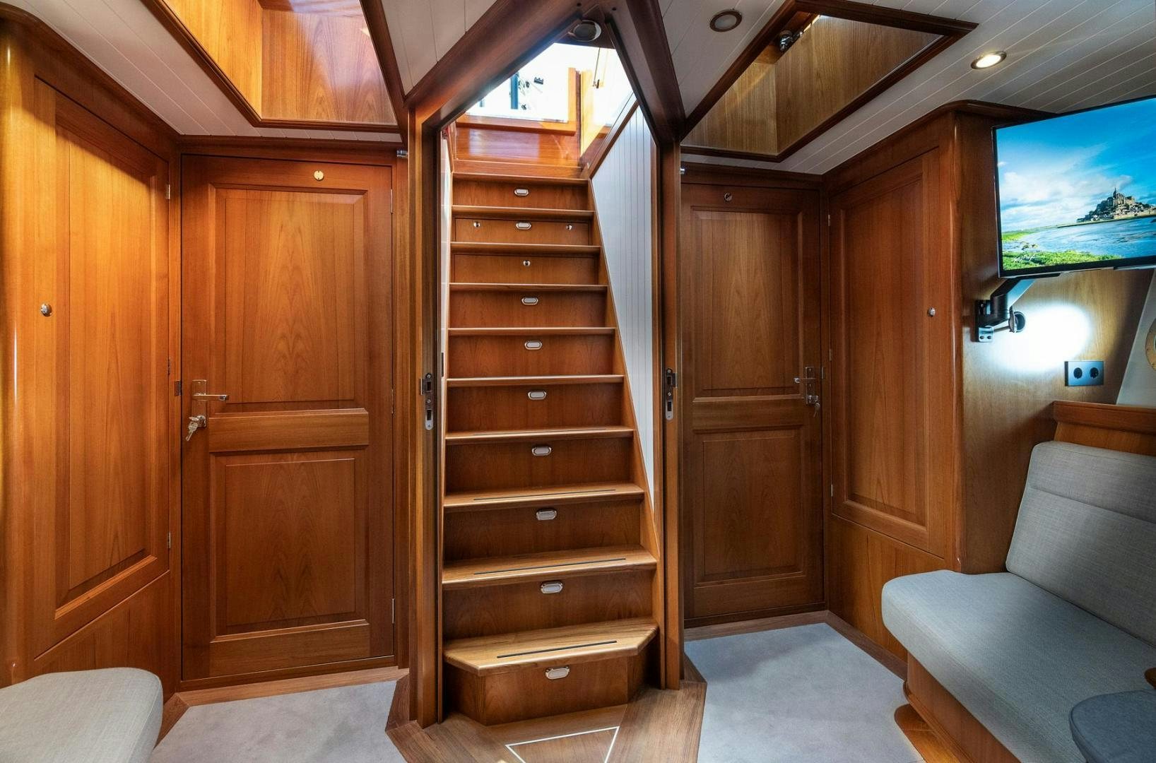a room with wooden cabinets aboard MELODY Yacht for Sale