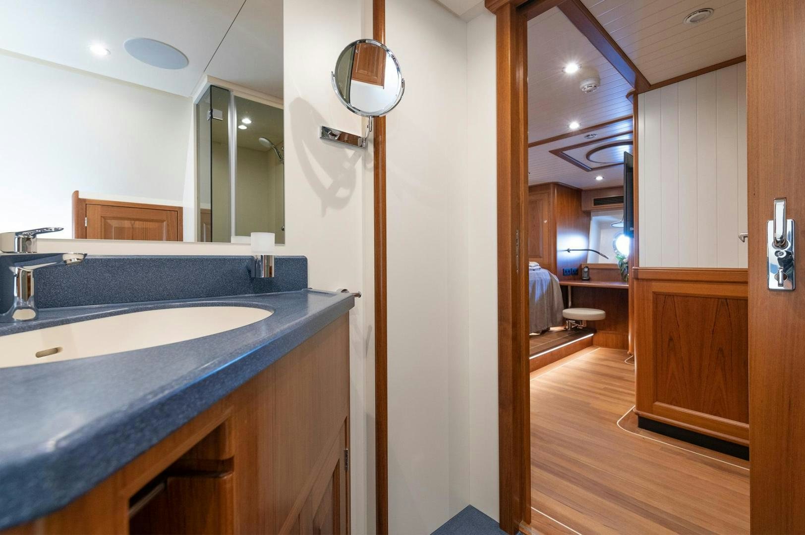 a bathroom with a sink and a mirror aboard MELODY Yacht for Sale
