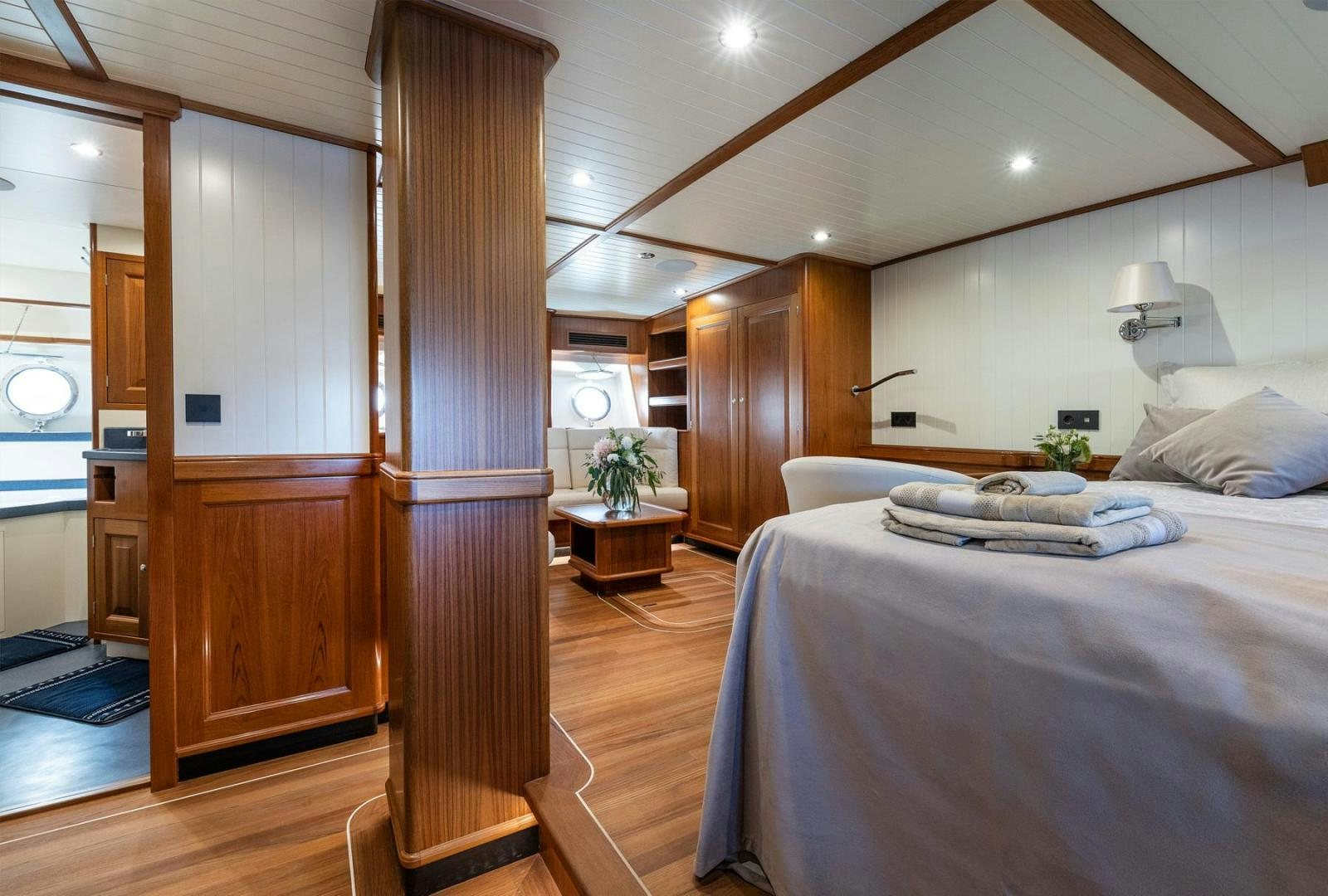 a bedroom with a bed and a closet aboard MELODY Yacht for Sale