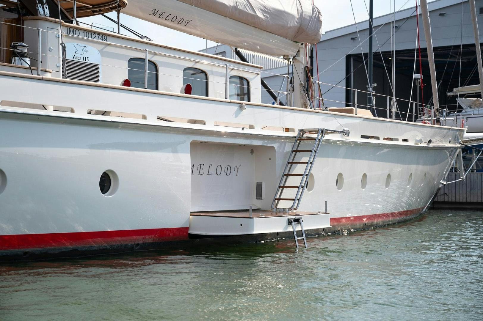 a boat docked in the water aboard MELODY Yacht for Sale