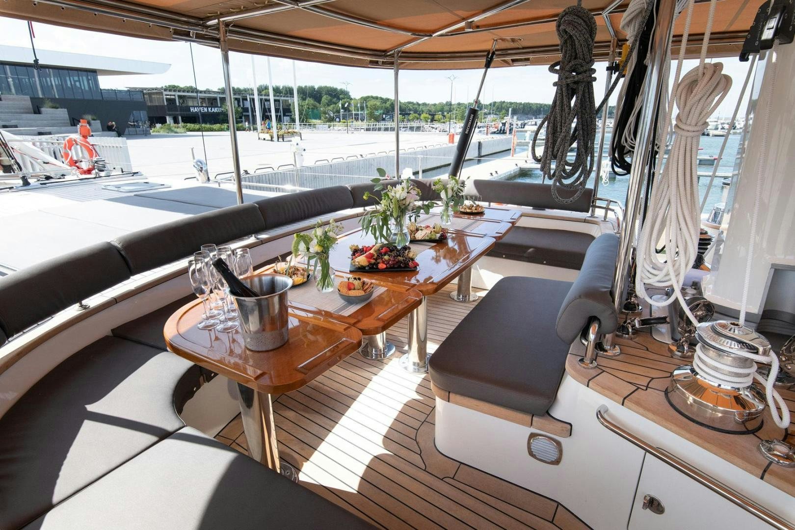 a room with a table and chairs aboard MELODY Yacht for Sale