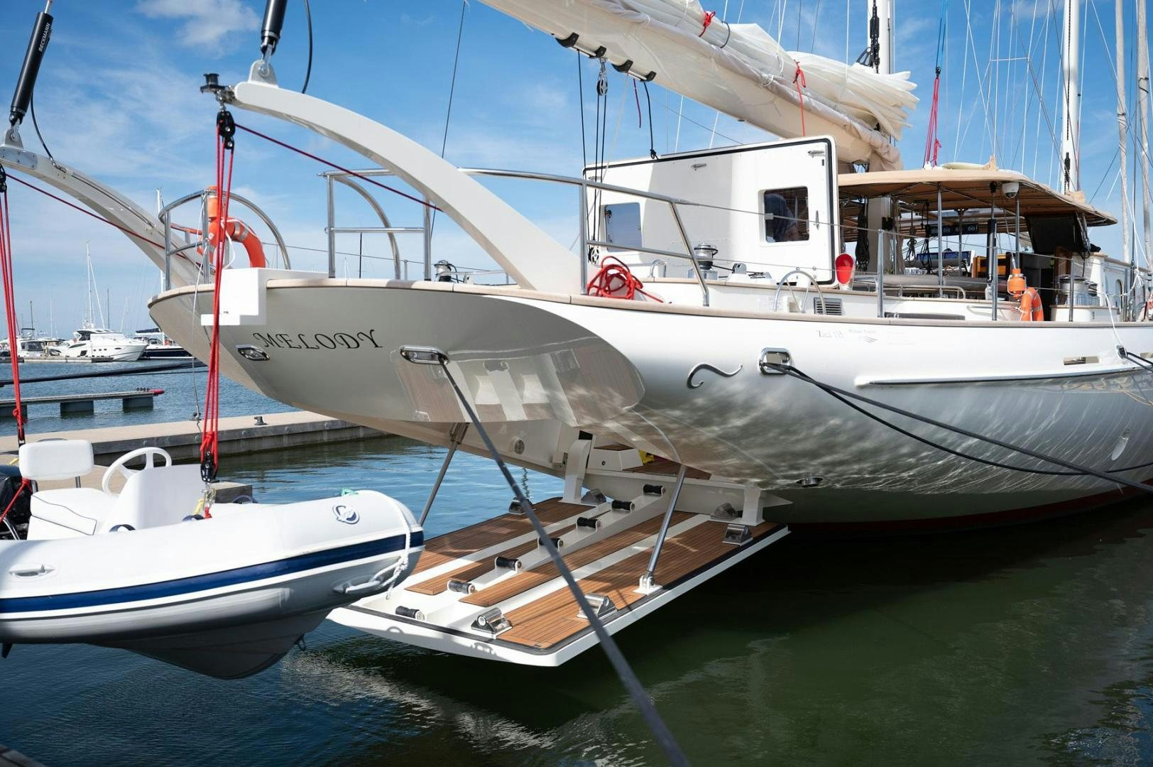a couple of boats sit in a harbor aboard MELODY Yacht for Sale