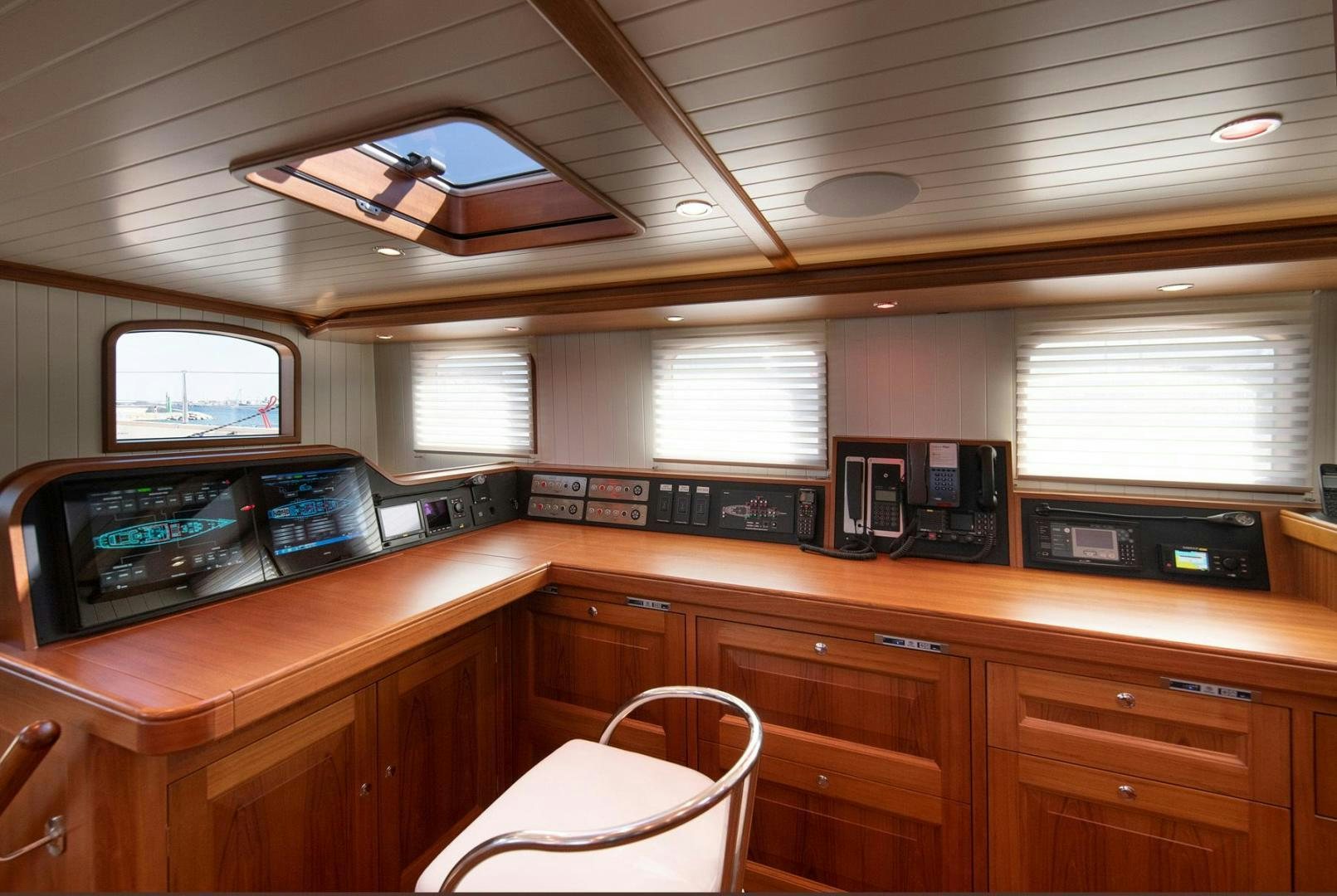 a kitchen with wooden cabinets aboard MELODY Yacht for Sale