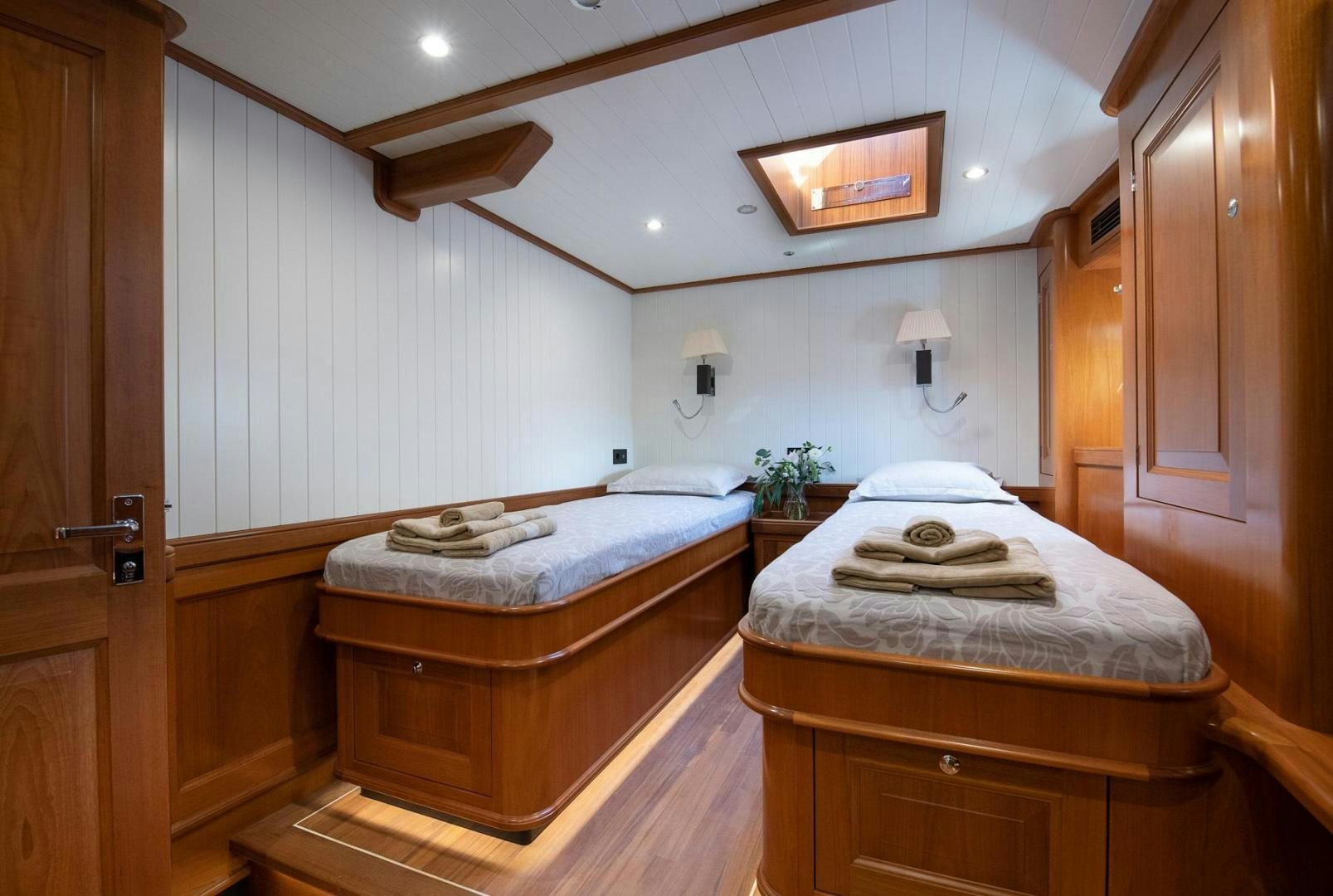 a couple of beds in a hotel room aboard MELODY Yacht for Sale