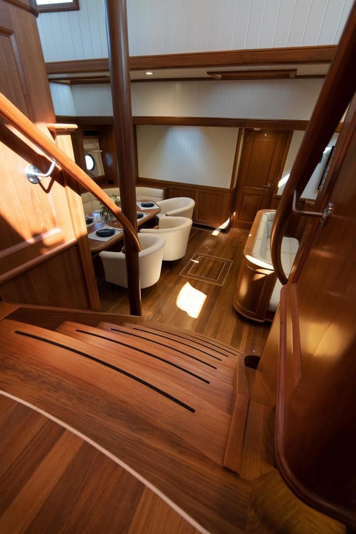 a bathroom with wooden floors aboard MELODY Yacht for Sale