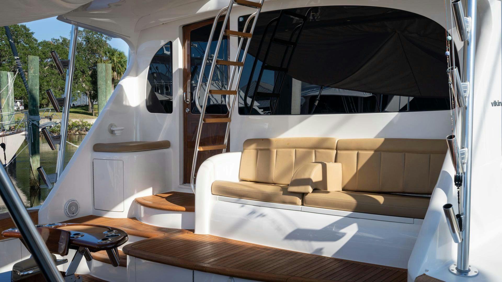a room with a couch and a ladder aboard HOW SWEET IT IS Yacht for Sale