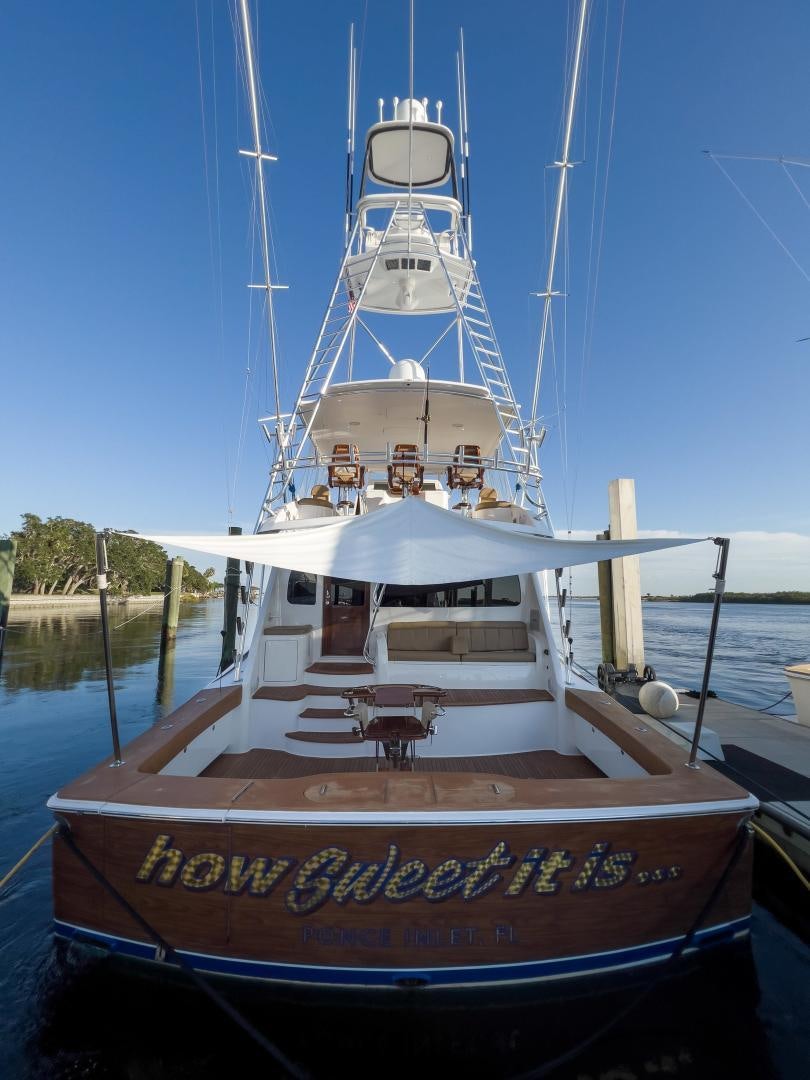 a boat docked at a pier aboard HOW SWEET IT IS Yacht for Sale