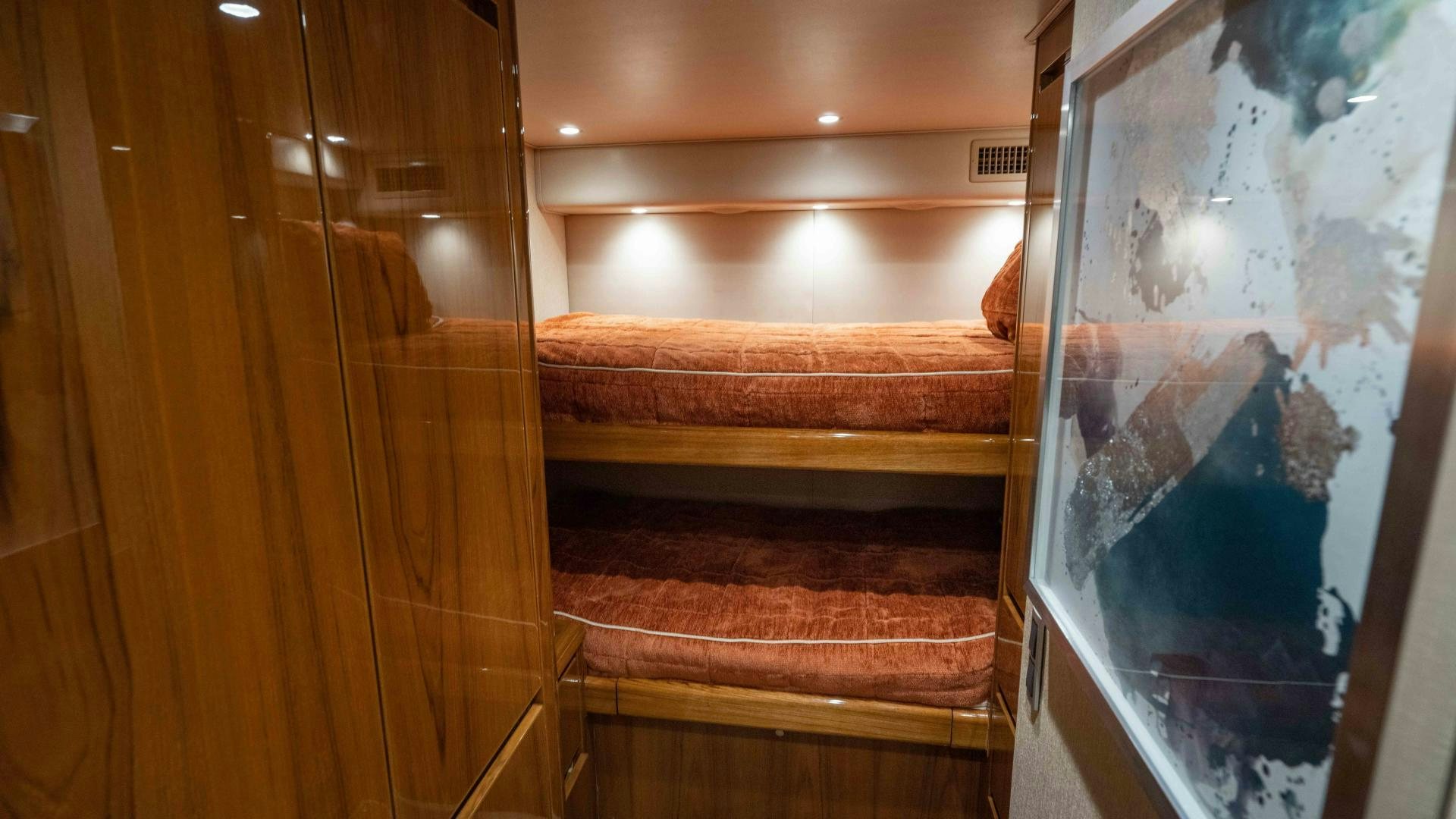 a glass door leading to a bed aboard HOW SWEET IT IS Yacht for Sale