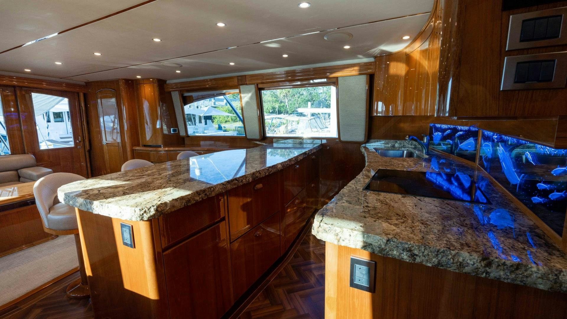 a kitchen with a large island aboard HOW SWEET IT IS Yacht for Sale