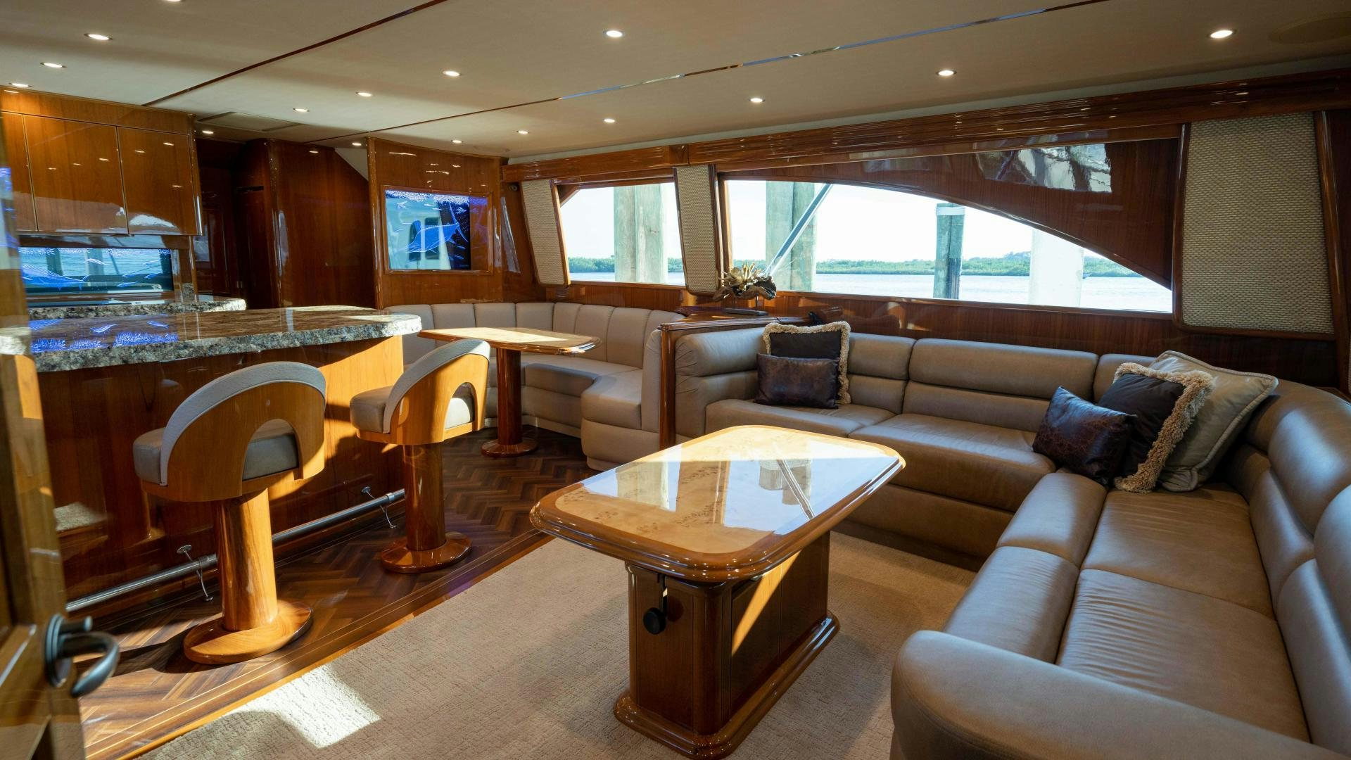a living room with a couch and a table aboard HOW SWEET IT IS Yacht for Sale