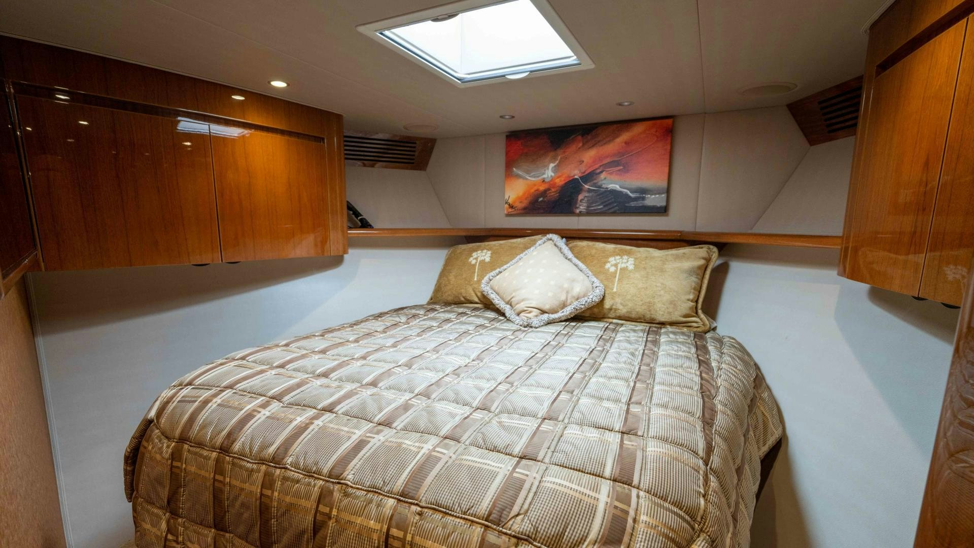 a bed with pillows aboard HOW SWEET IT IS Yacht for Sale