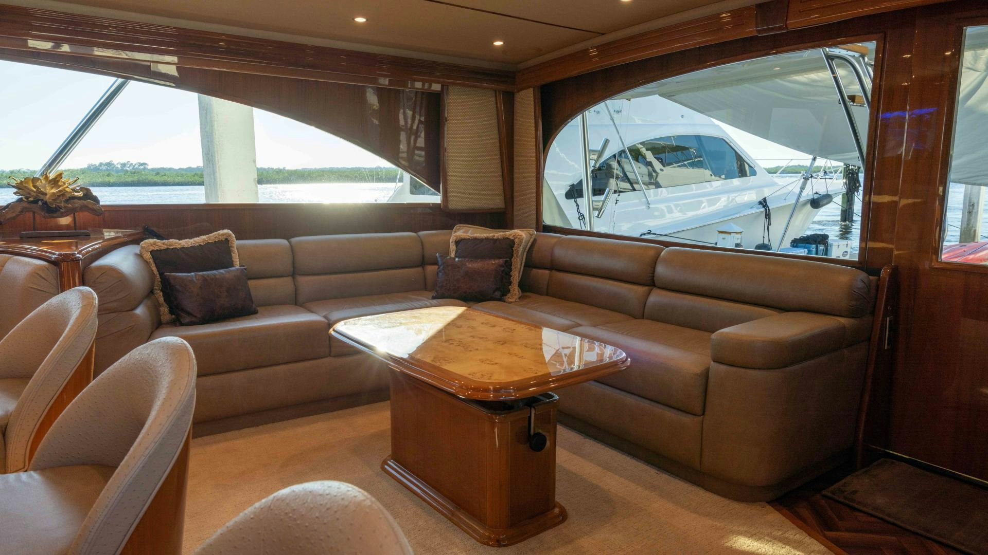 a living room with a couch and a coffee table aboard HOW SWEET IT IS Yacht for Sale