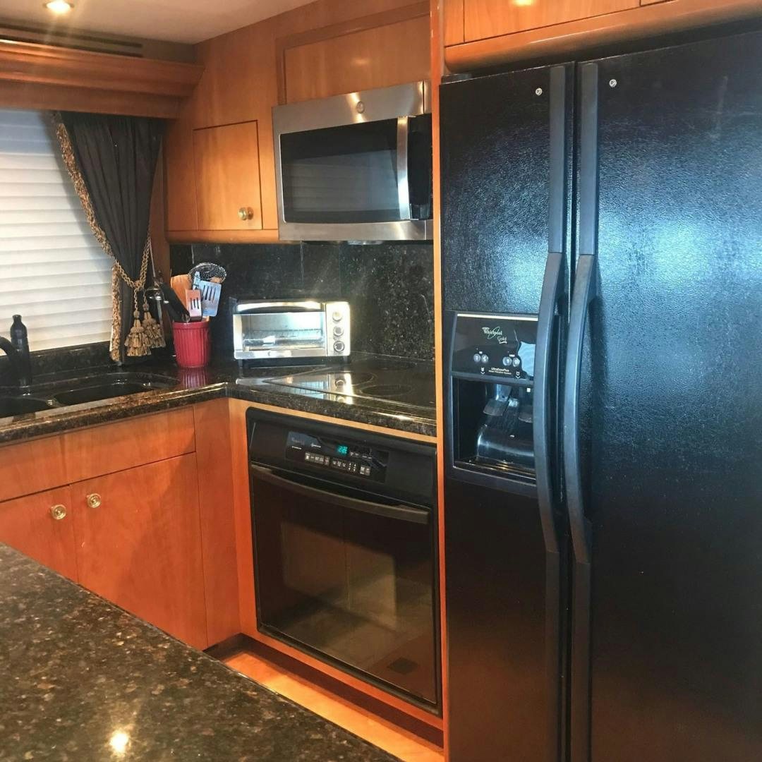 a kitchen with stainless steel appliances aboard SOCIAL DIRECTOR Yacht for Sale