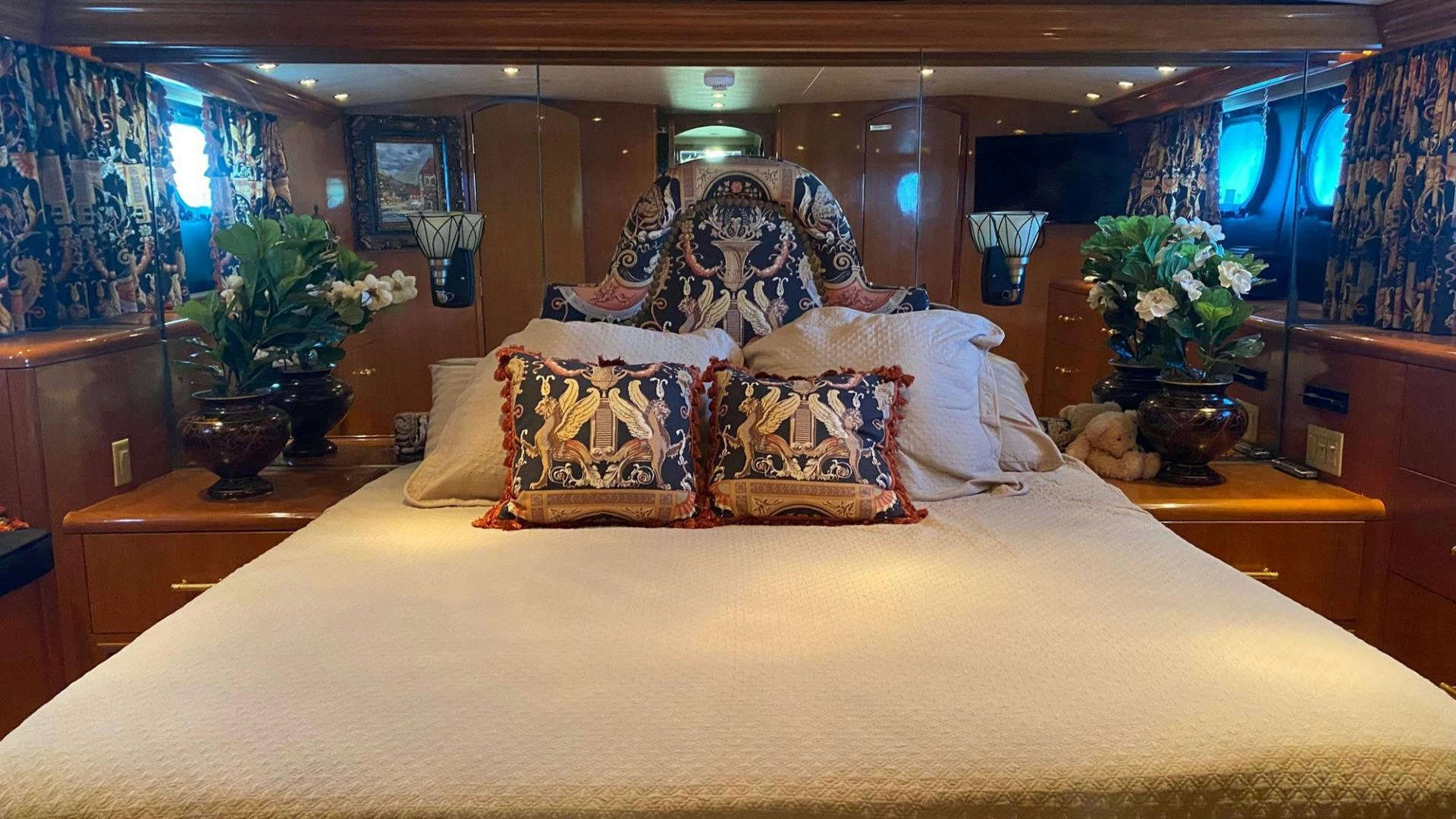a bed with a flowered bed spread aboard SOCIAL DIRECTOR Yacht for Sale