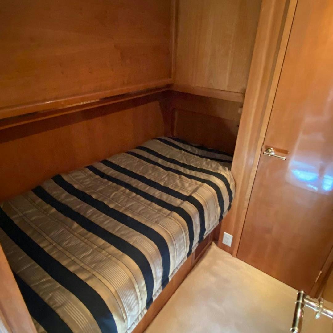 a bed in a room aboard SOCIAL DIRECTOR Yacht for Sale
