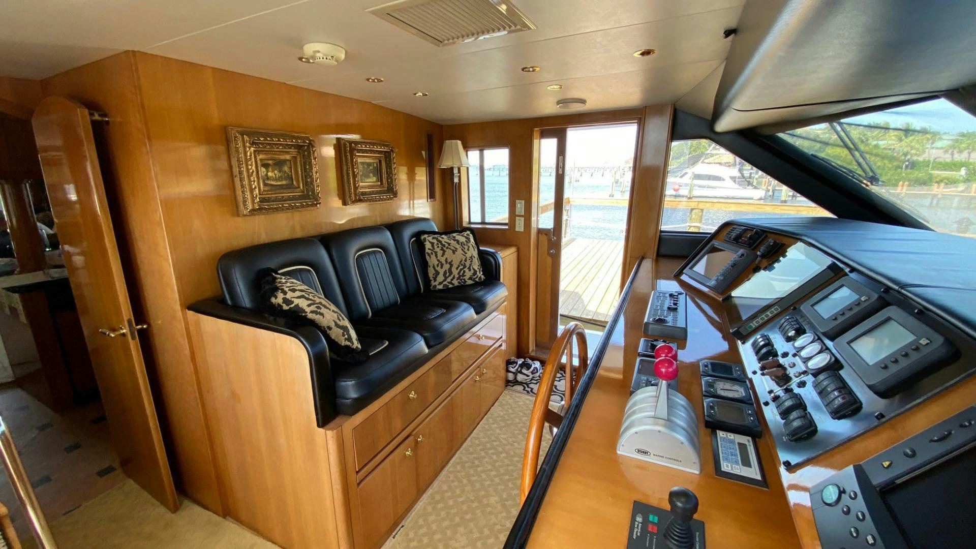 a living room with a couch and a table aboard SOCIAL DIRECTOR Yacht for Sale