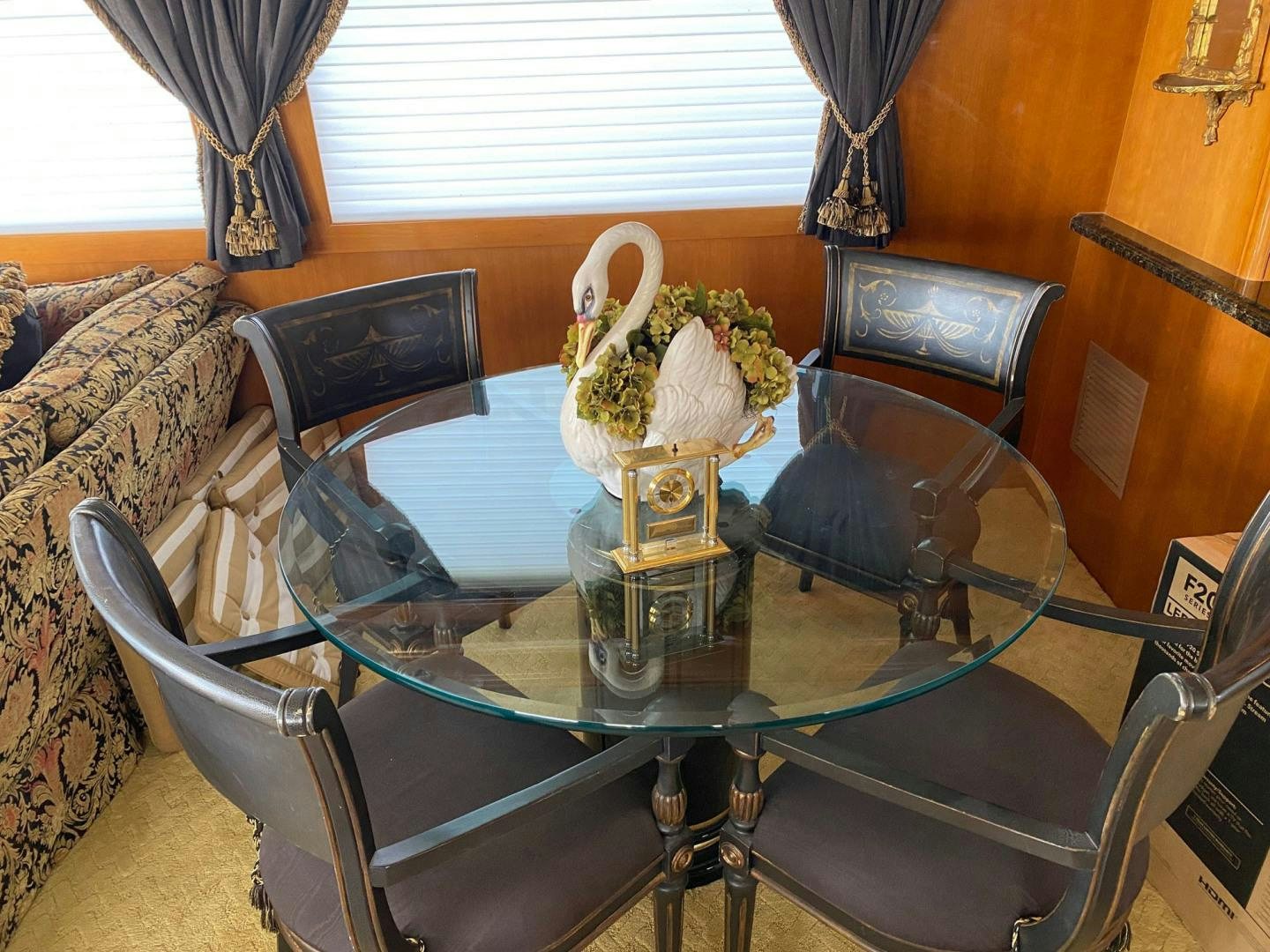 a glass table with a vase of flowers on it aboard SOCIAL DIRECTOR Yacht for Sale