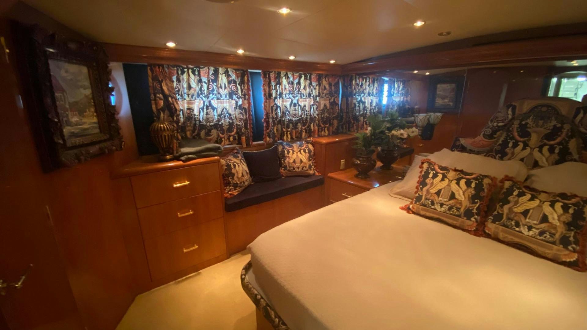 a room with a bed and a dresser aboard SOCIAL DIRECTOR Yacht for Sale
