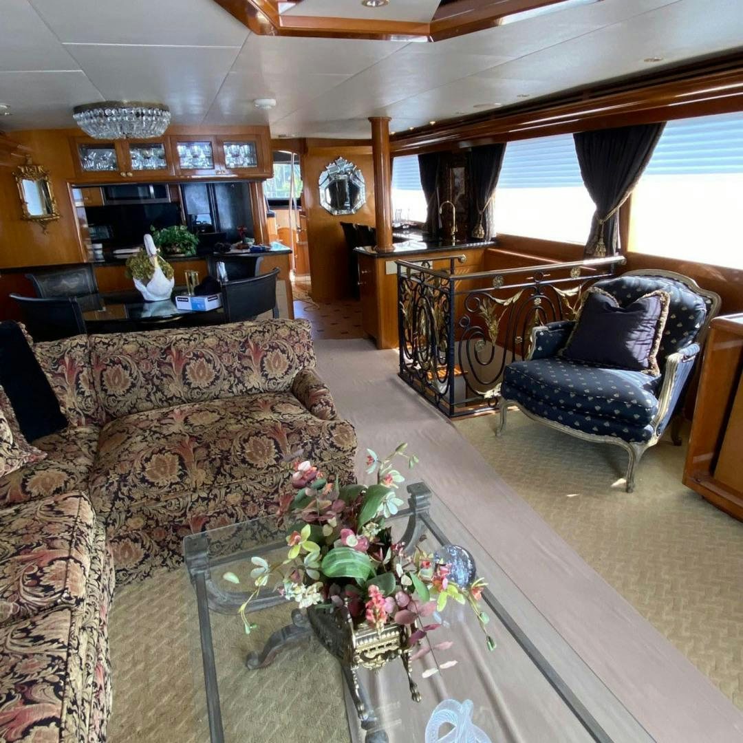 a living room with a large window aboard SOCIAL DIRECTOR Yacht for Sale