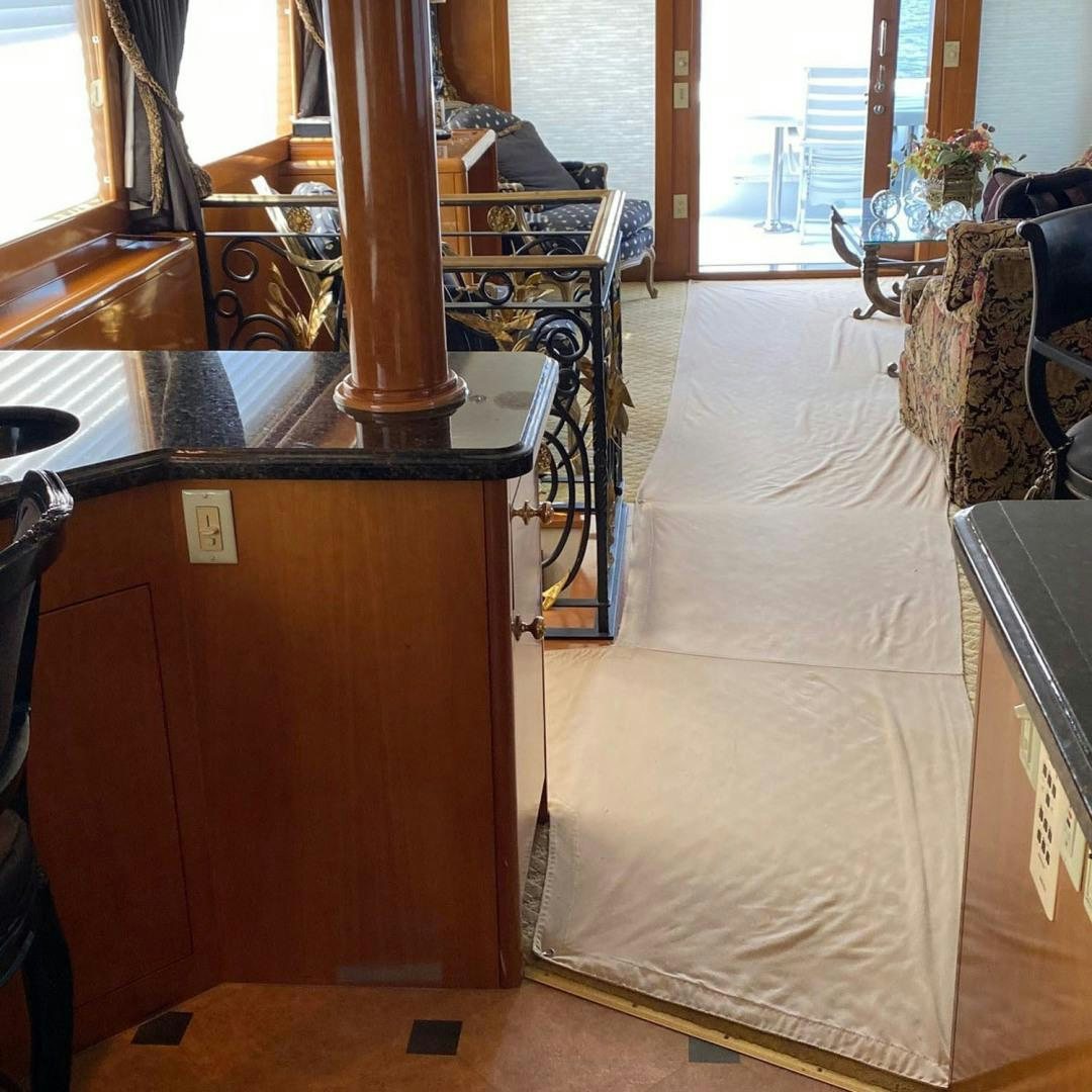 a room with a bed and a table aboard SOCIAL DIRECTOR Yacht for Sale