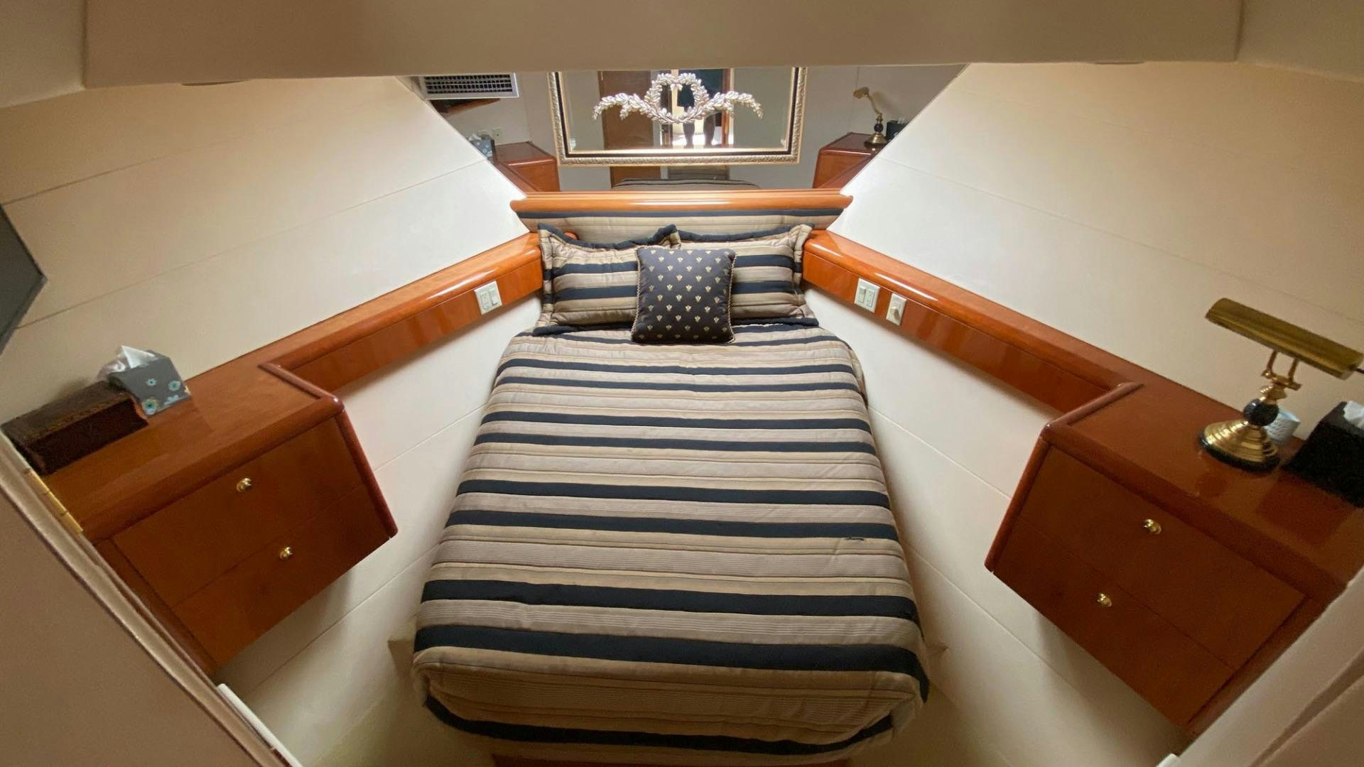 a room with a bed and a desk aboard SOCIAL DIRECTOR Yacht for Sale