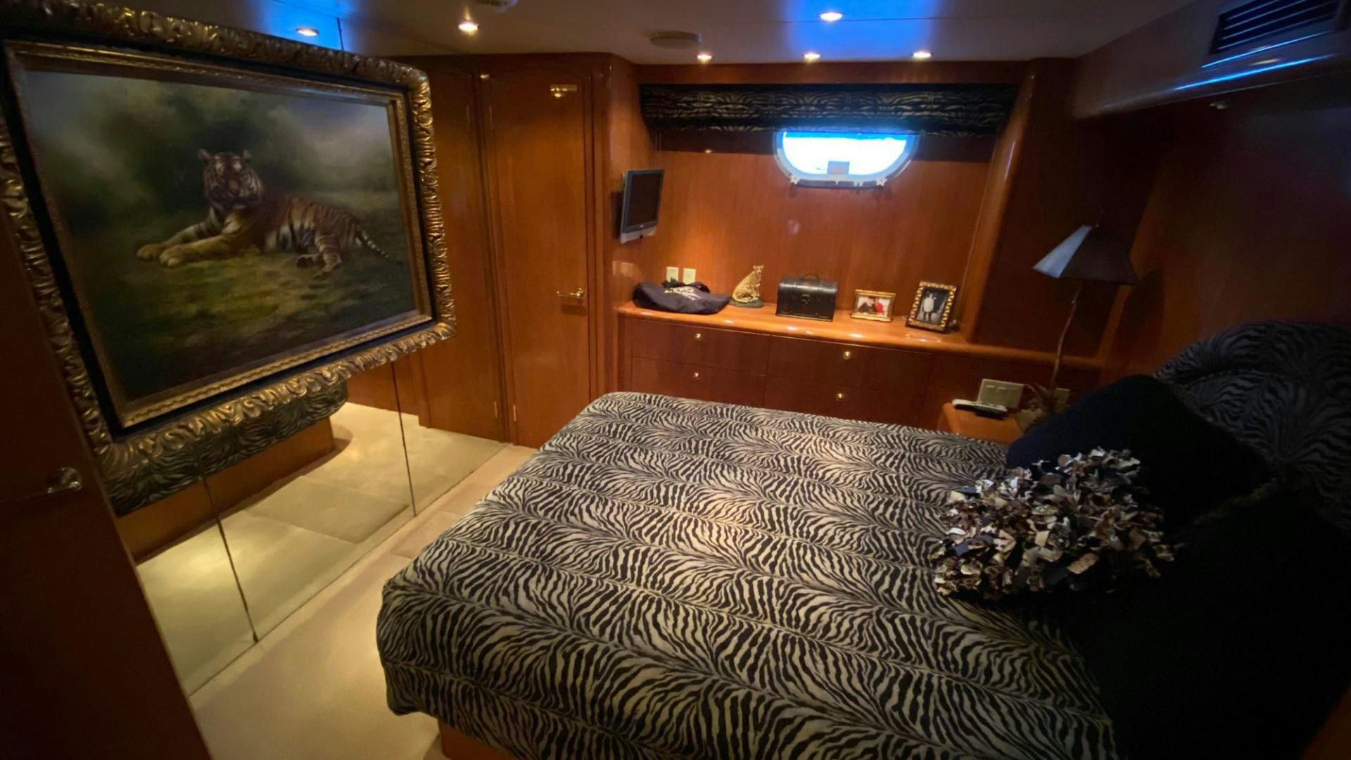 a living room with a large painting aboard SOCIAL DIRECTOR Yacht for Sale