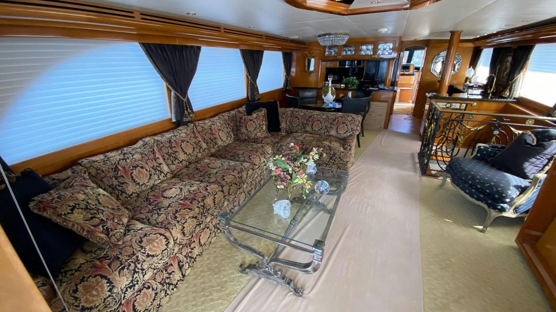 a living room with a couch and a coffee table aboard SOCIAL DIRECTOR Yacht for Sale