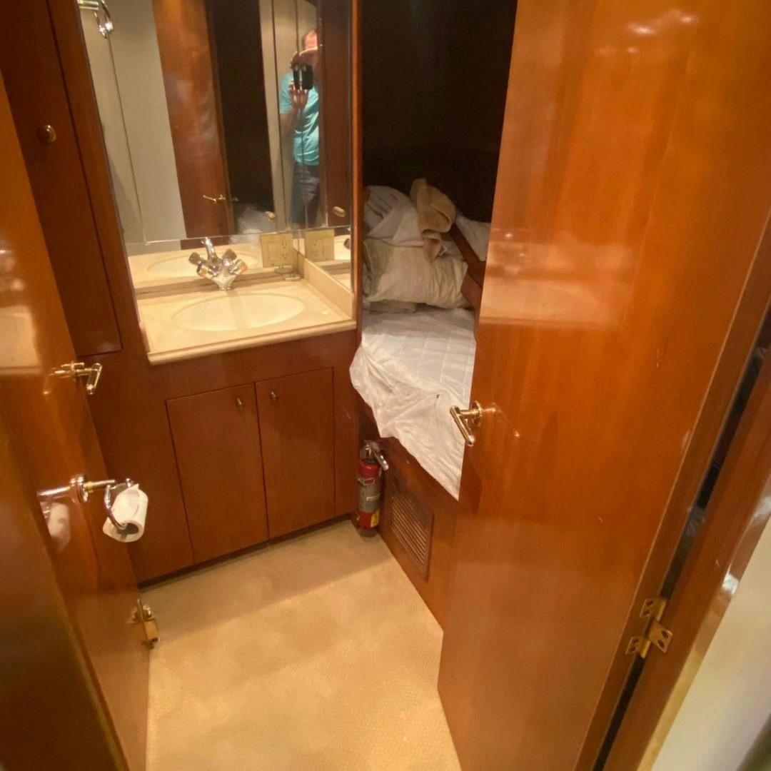 a bathroom with a towel on the wall aboard SOCIAL DIRECTOR Yacht for Sale
